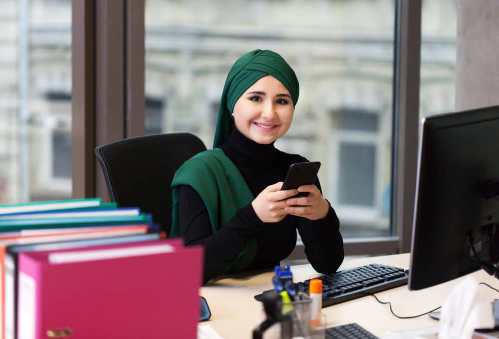 Muslim asian woman working in office with laptop
