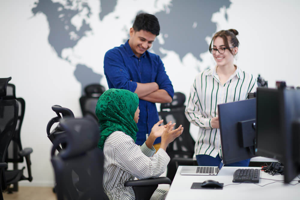 multiethnic-startup-business-team-arabian-woman-wearing-hijab-meeting-modern-open-plan-office-interior-brainstorming-working-laptop-desktop-computer